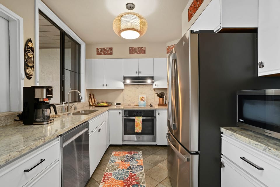 Bright, modern kitchen with stainless appliances—perfect for effortless island living.