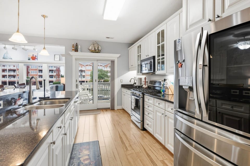 Cook up your favorite dishes in the fully equipped kitchen with sleek appliances and counter bar seating.