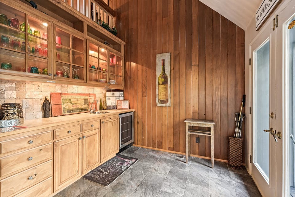Little bar area off living room and heads out to the back patio and pool area