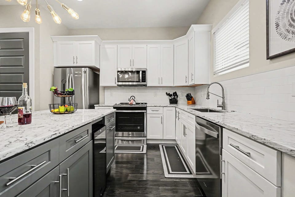 The fully equipped, modern kitchen is stocked with all the culinary essentials, including stainless-steel appliances and a wine cooler. (2nd Floor)
