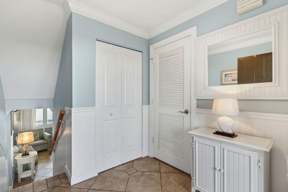 You enter at Foyer: Stairs lead down to Main Living Area