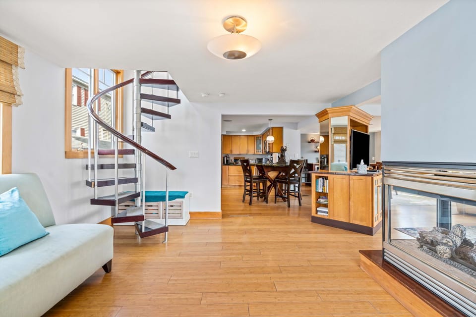 The second entrance, with a sitting area, gas fireplace, and access to the upstairs unit (if you rent the entire property).
