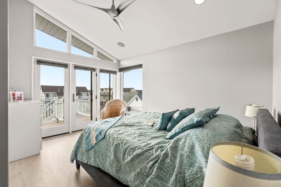 The second bedroom in the penthouse with a queen bed and clean provided linens