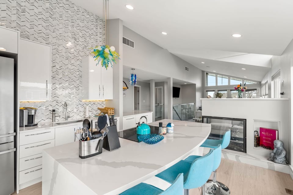 Fully renovated and equipped kitchen with high end Miele appliances, induction stove top, and seating for 4 at the island (+2 at the peninsula).
