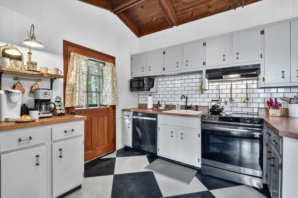 Fully-stocked kitchen at this mountain view cabin in Ellijay  