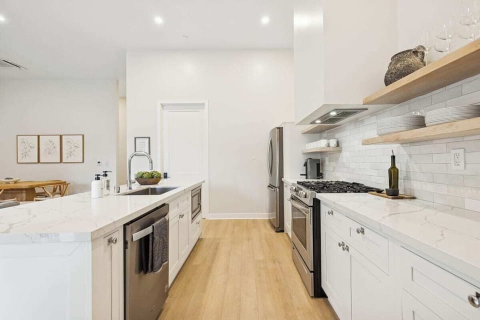 Full kitchen: Nespresso, fridge, stove/oven, plates and utensils, dishwasher