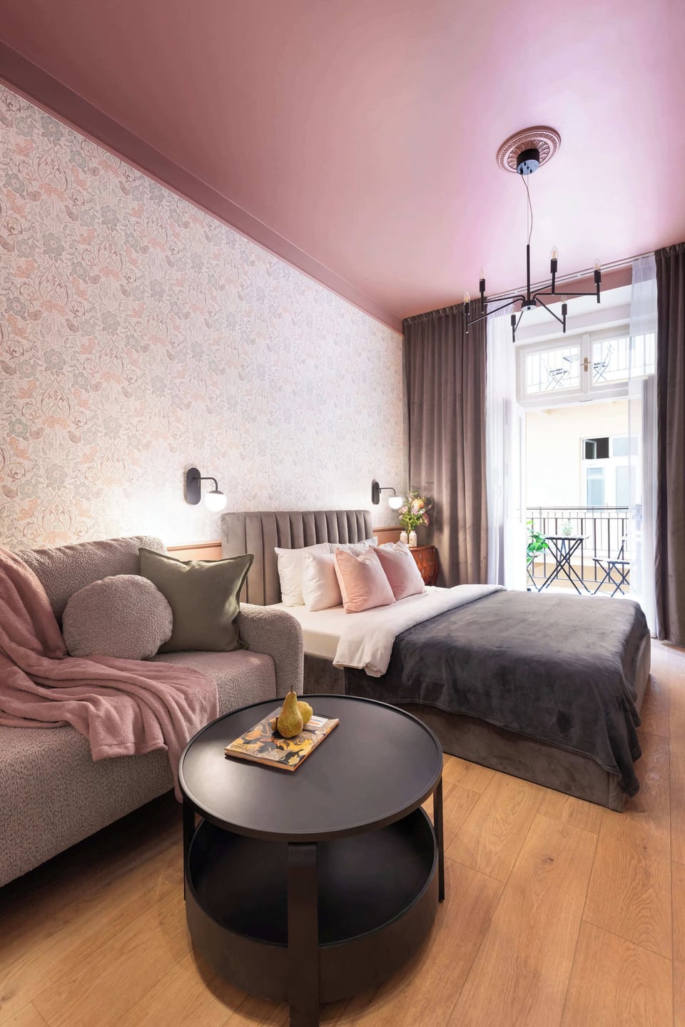 The apartment opens onto a traditional gallery-style balcony (pavlač).