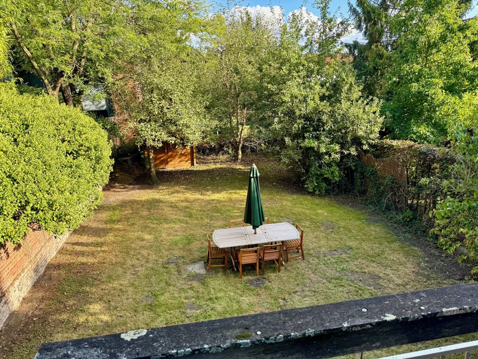 Peaceful garden-view balcony — the perfect spot for your morning coffee