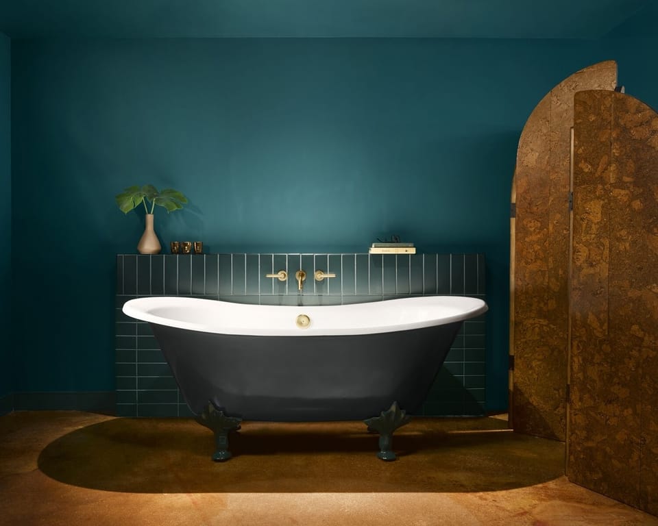 Soak slowly in a sculptural tub under calming tones.