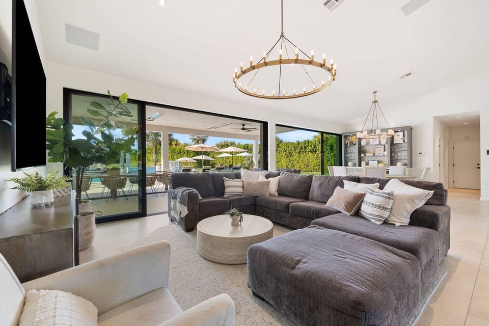 Comfortable living area, with ample light, leading to outdoor area