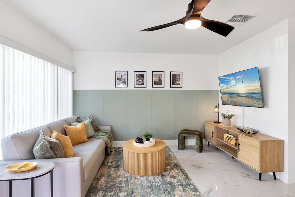 Living room features a generously sized Roku smart TV.