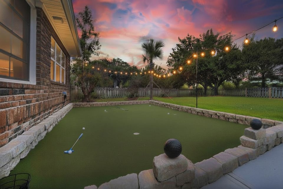 Bistro lights, Palm trees, Putting Green, Fire Pit, Dining Table, Glider