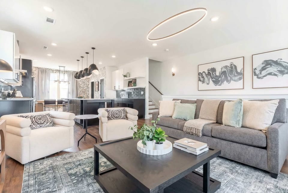 The kitchen opens straight into living space so the cook never gets cut off from the crew. Gas range, griddle, island seating, and everyone stays connected