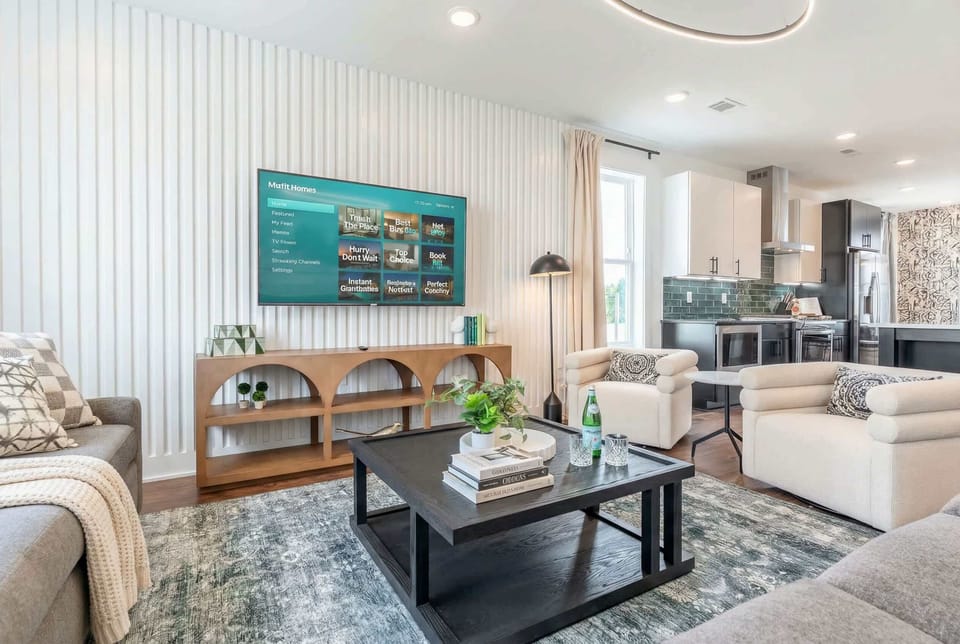 Open-plan kitchen and living room mean the cook never feels left out and the group stays connected while dinner happens