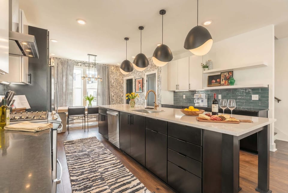 Cook with the griddle and gas range while friends settle onto bar stools at the island, never missing a moment of the conversation