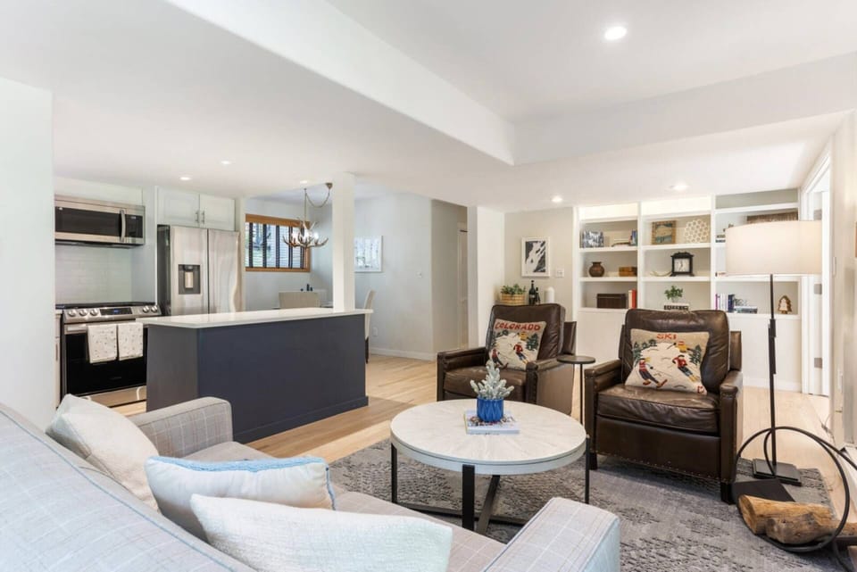 The open-concept living room and kitchen create the perfect space for socializing and enjoying culinary delights together.