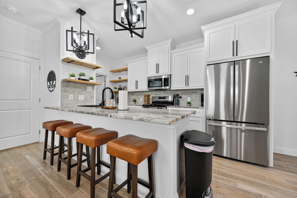 Spacious island with seating for four—great for meals or morning coffee.