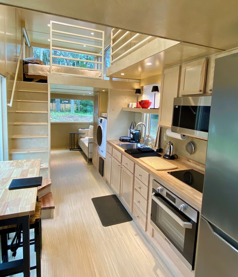 Huge open layout with impressive height, a large second floor and big windows