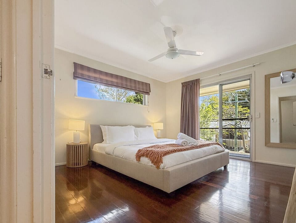 Rest easy in the light-filled bedroom with two comfortable beds