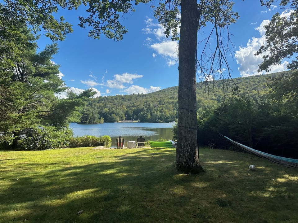 Large backyard for yard games and relaxing leading to your own private beach.
