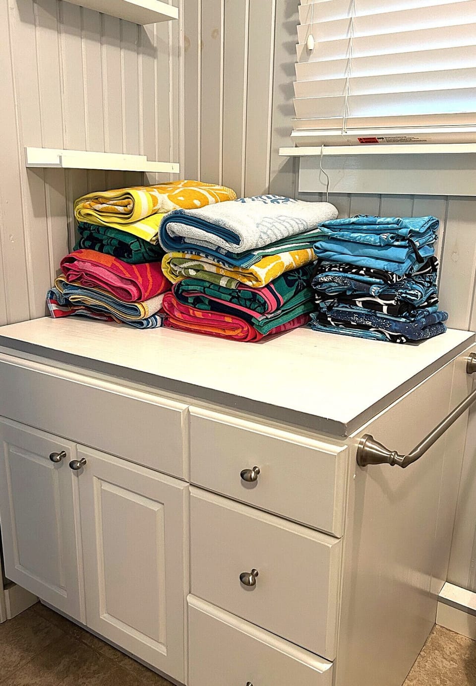 Lots of beach towels in the main cottage bathroom