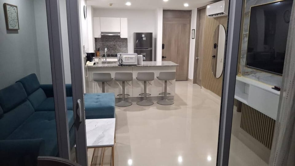 Balcony view of living room and kitchen