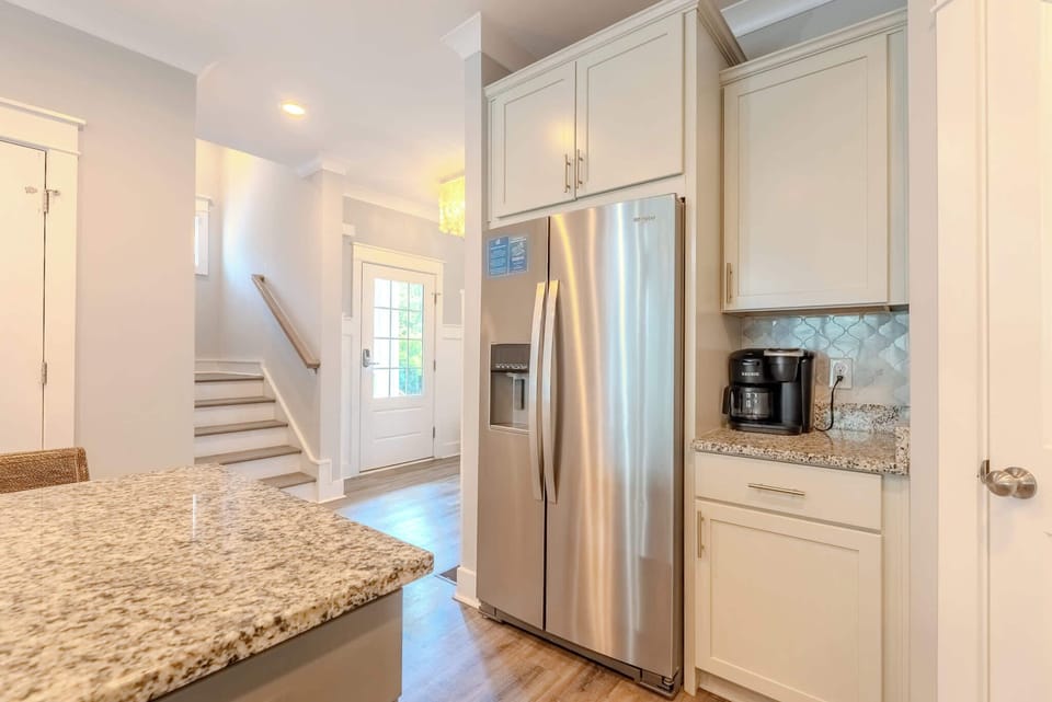 Well-equipped kitchen featuring a full-size fridge for all your storage needs.