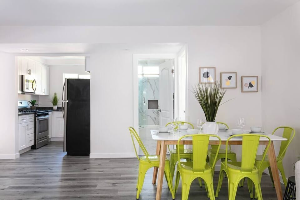 Pops of green chairs add a fresh touch to your mealtime