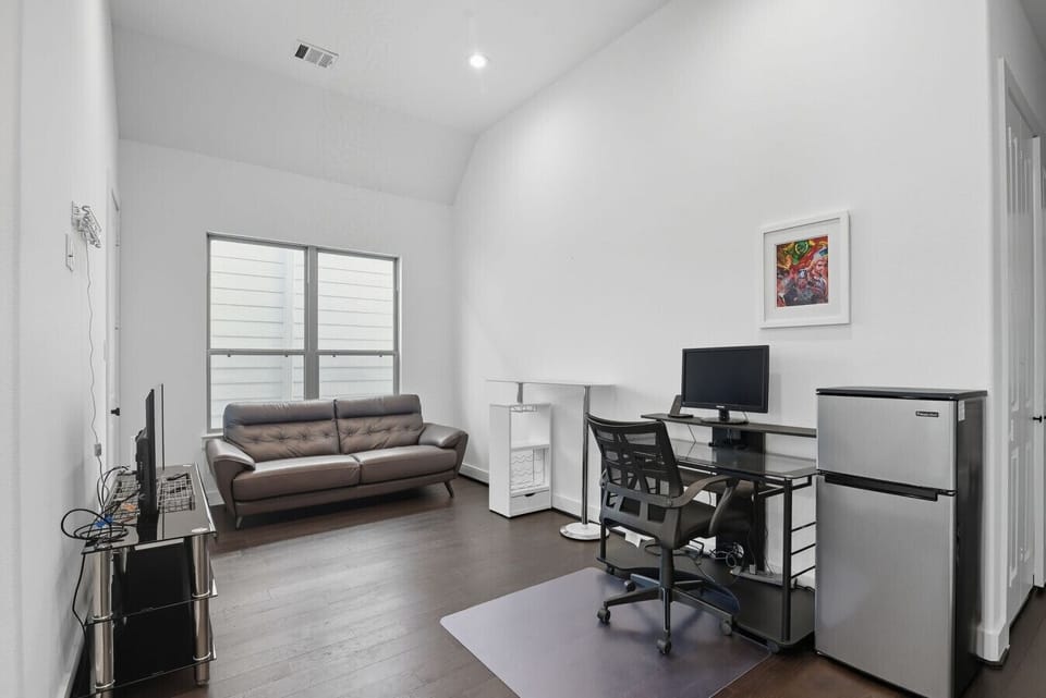 Upstairs Area with work station and mini fridge