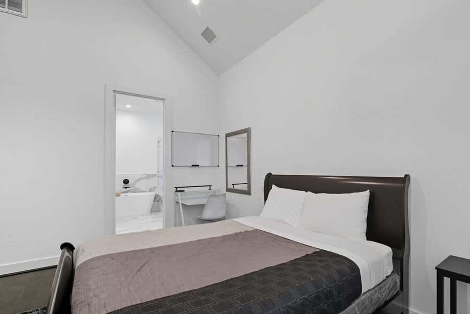 Primary Bedroom with workstation and bathroom