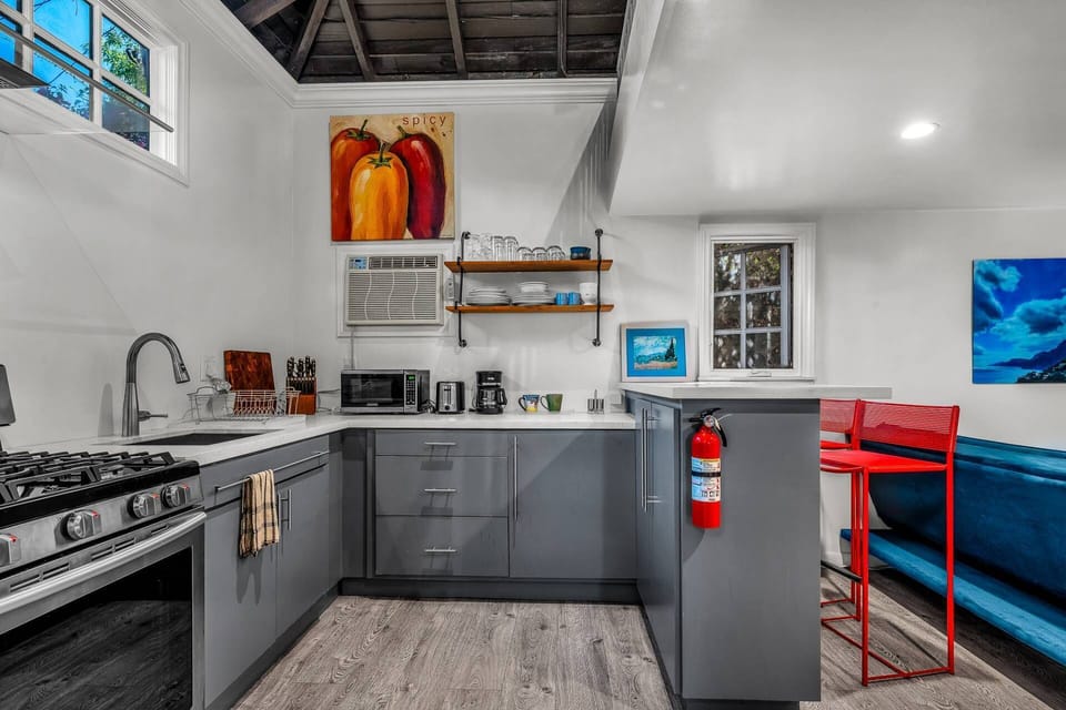 Prepare a meal and pull up a chair in this compact and vibrant kitchen!