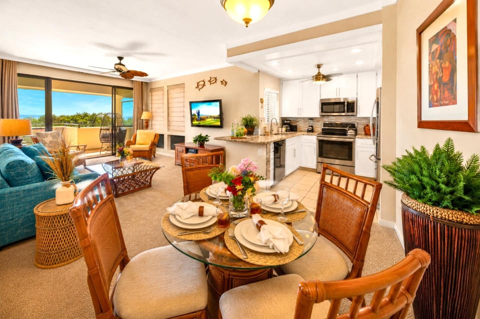 A dining table for four sits between the kitchen and living room, ready for breakfast in or a full sit-down meal.