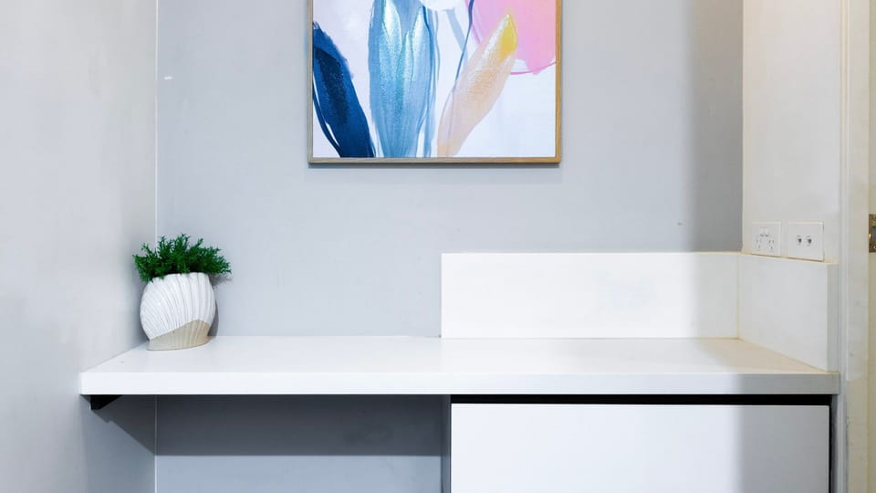 Minimalist workspace with wall art and bright décor