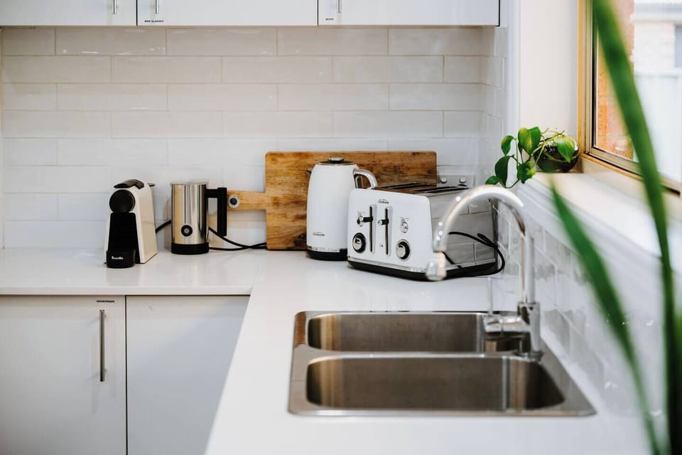 Start your day at the coffee nook, complete with a Nespresso machine, milk frother, toaster, kettle, and essentials for your morning ritual.