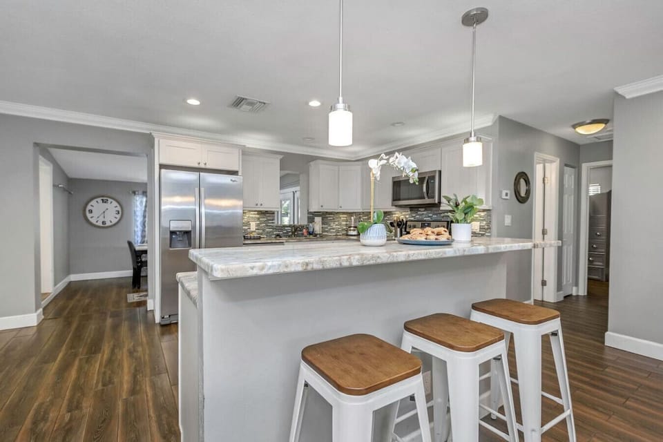 Share coffee, snacks, or happy hour drinks around the inviting island counter.