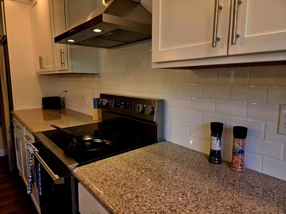 Granite counters with tile backsplash