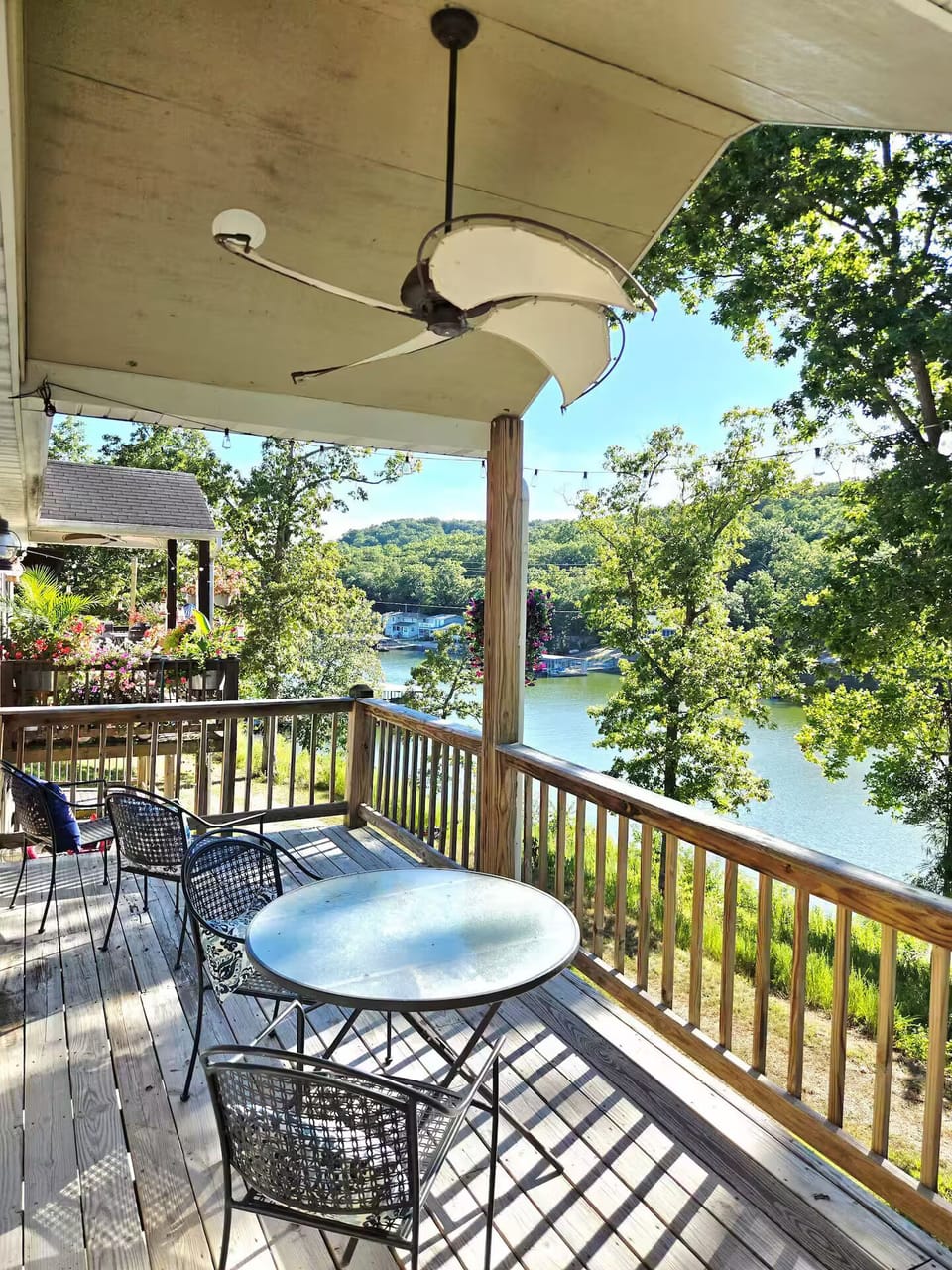 View of the lake from the main floor deck.  Enjoy morning coffee or a meal here!