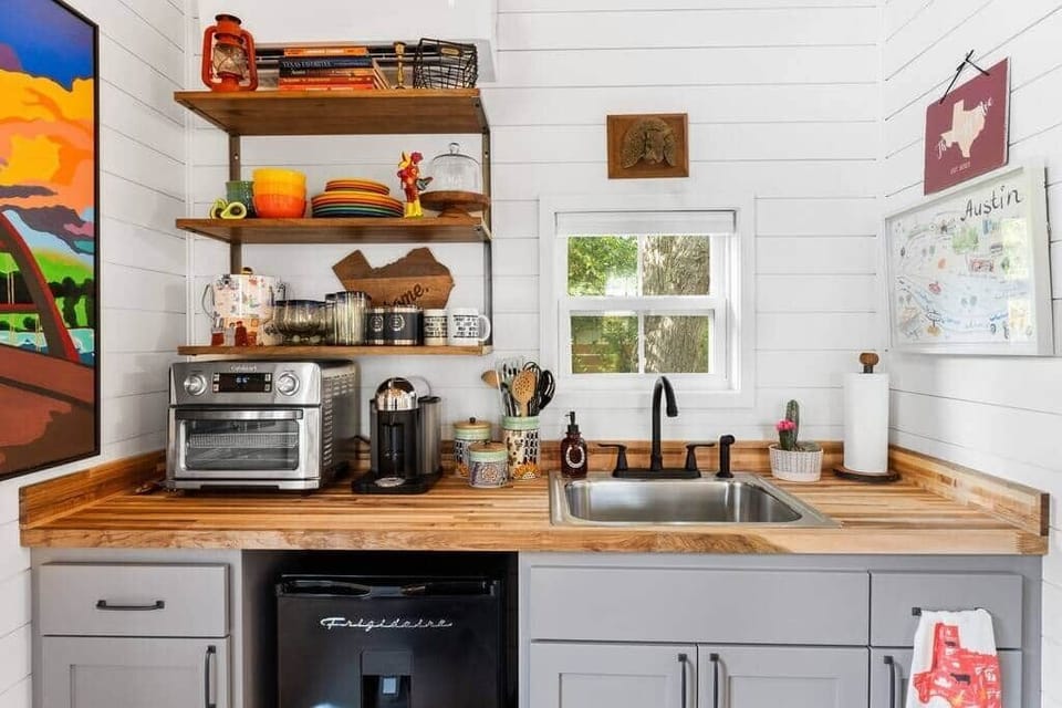 Kitchenette with Nespresso, mini fridge and combo countertop oven