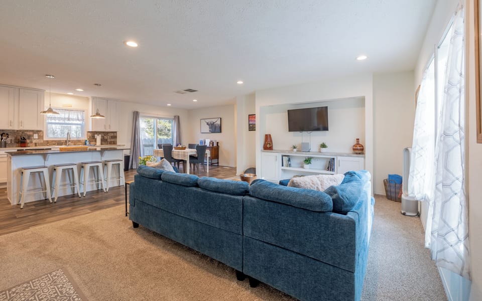 The open floorplan of the living, kitchen and dining room makes this home perfect for families or larger groups