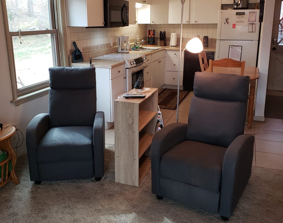 Cozy space with kitchen in the back.
