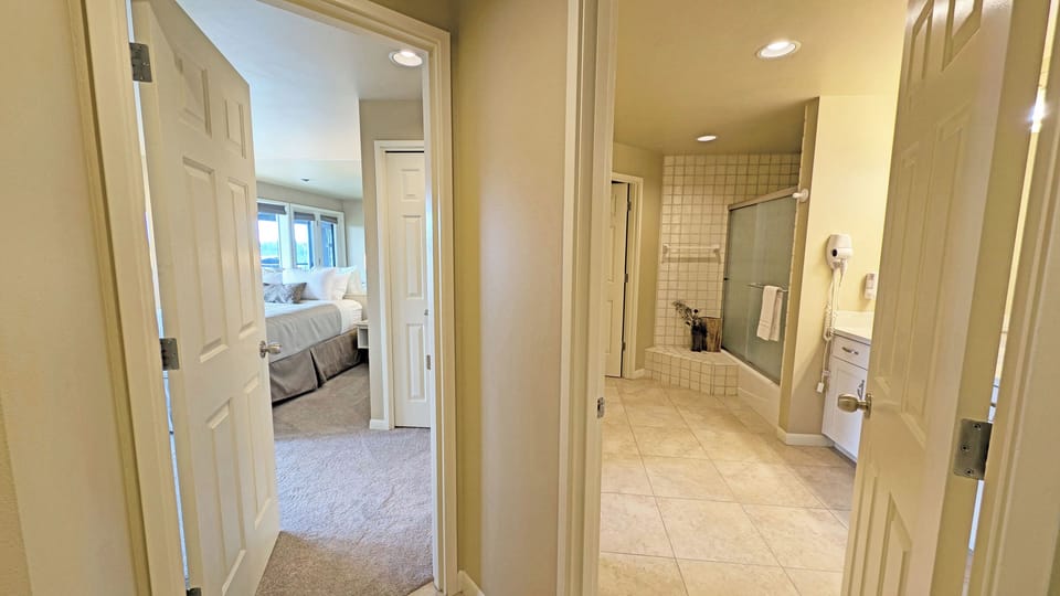 The bath is accessed from the hall and the bedroom