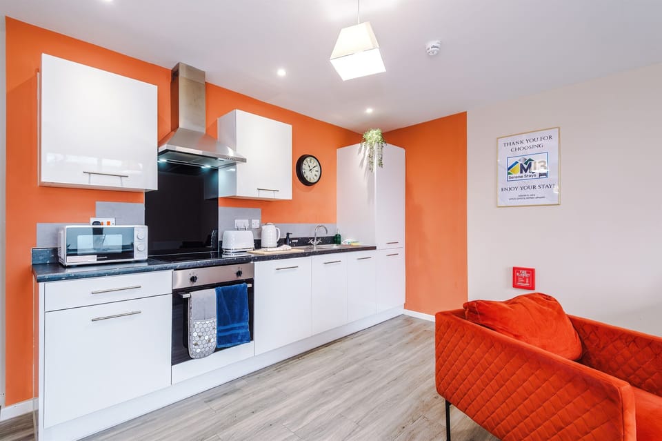 The modern kitchen benefits from utensils, crockery, microwave, oven, hob, dishwasher, fridge freezer & washer/dryer 