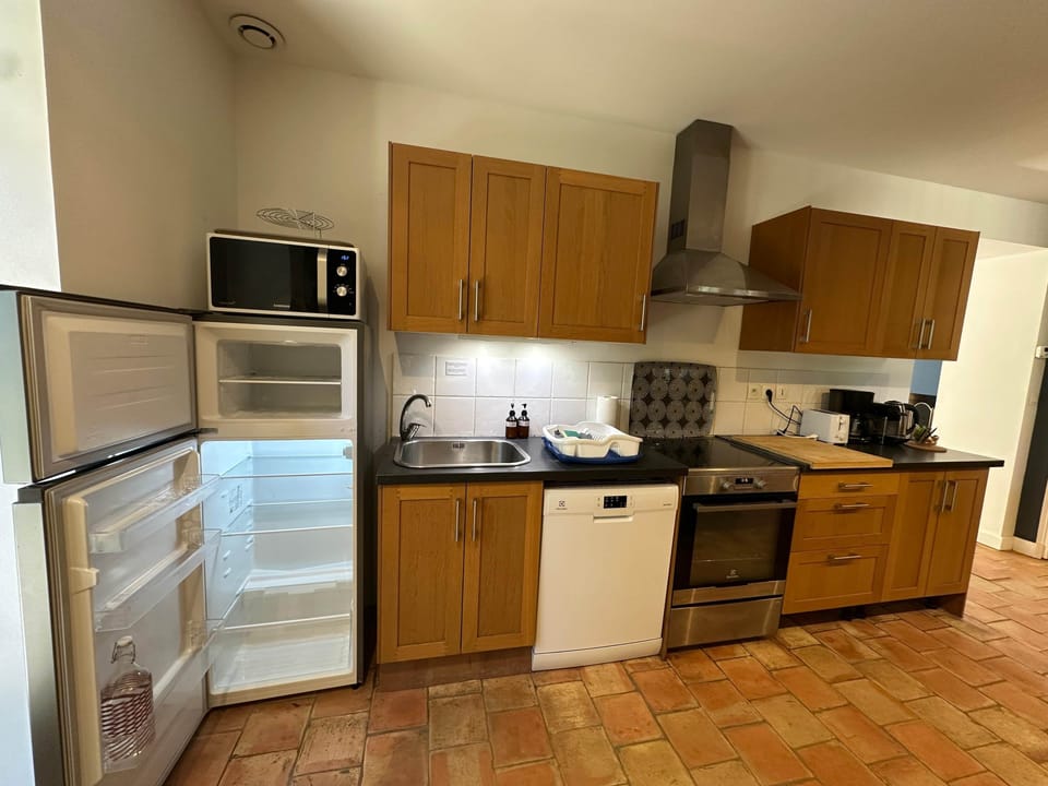 kitchen, micro wave, fridge, dining table, dishwasher, oven, toaster, coffee machine, kettle