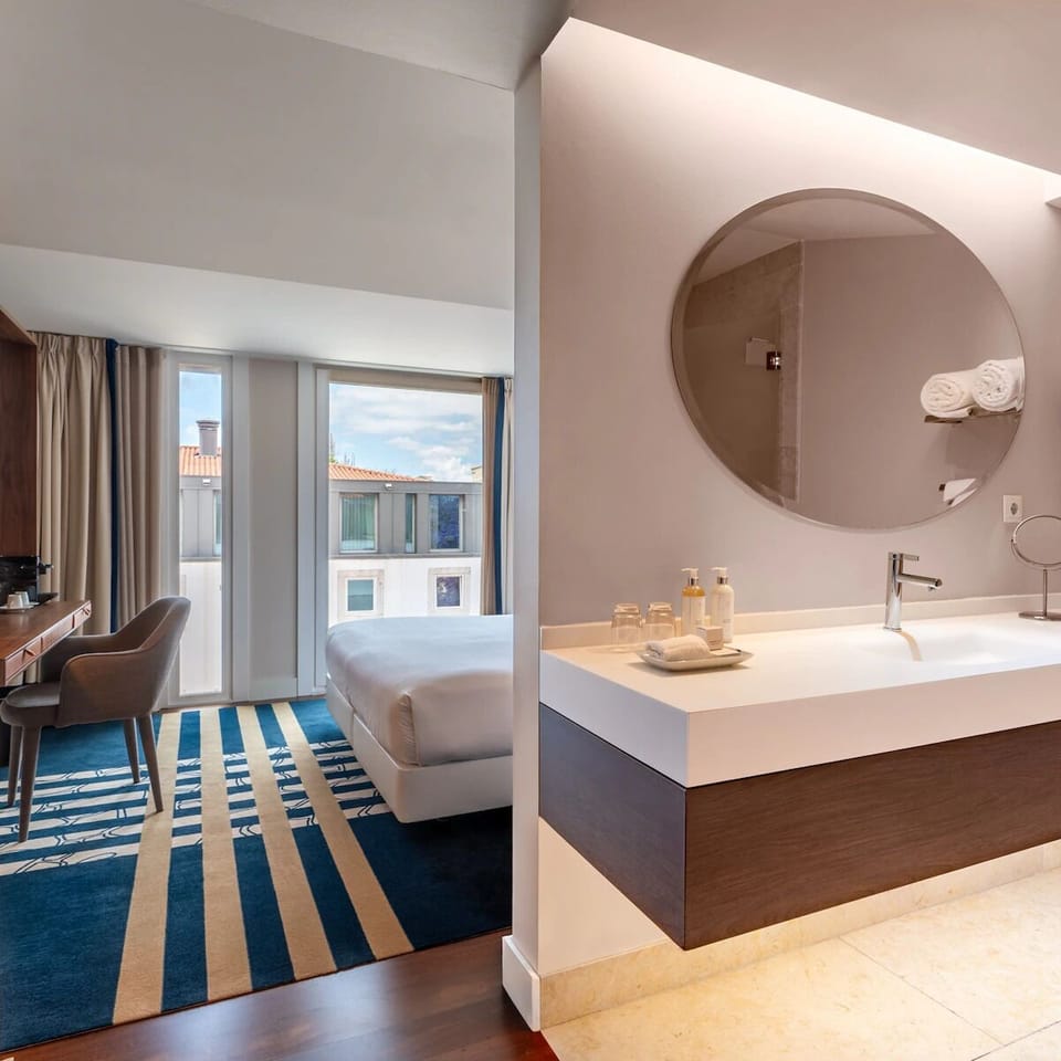 Ease into your routine with a sleek vanity and warm lighting.
