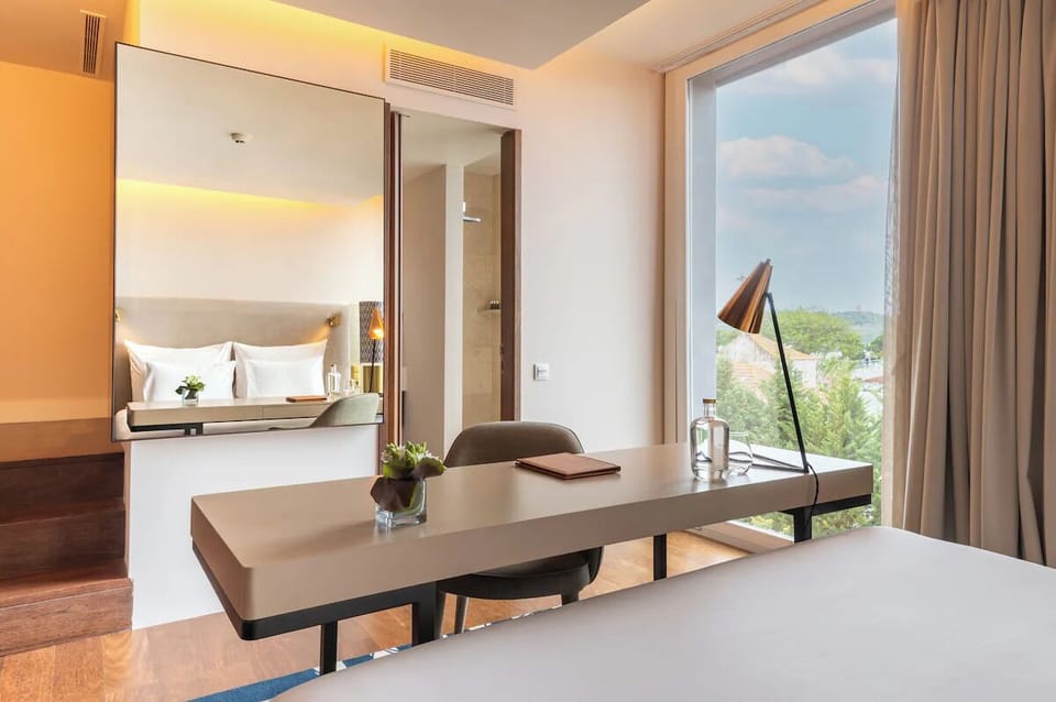 Work or dine comfortably at the in-room table by the view.