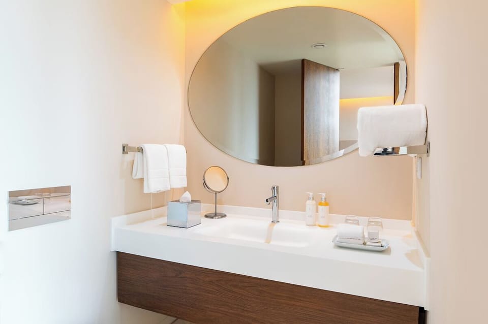 Pamper yourself with bright vanity space and fresh towels.