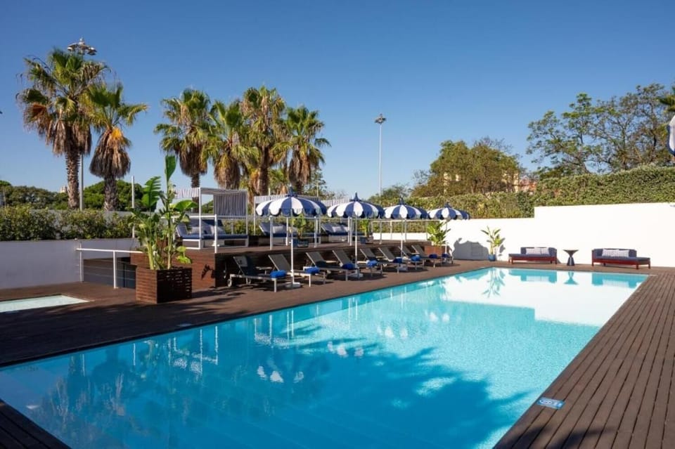 Swim long laps in a bright, tranquil pool setting.