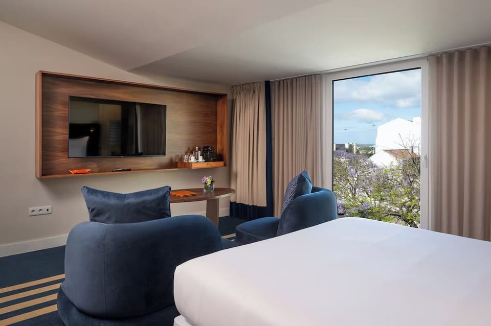 Unwind by the window with lounge seating and smart TV.