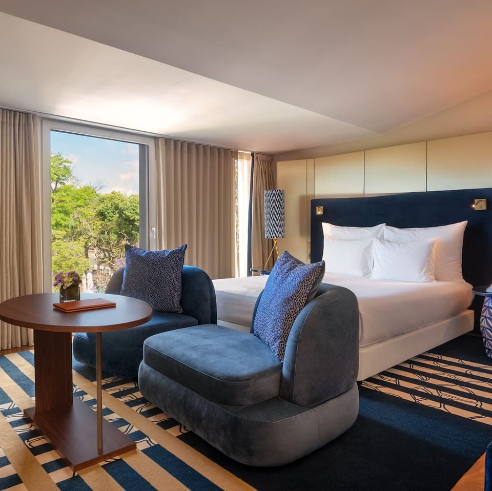 Sink into plush seating beside crisp linens and sunshine.