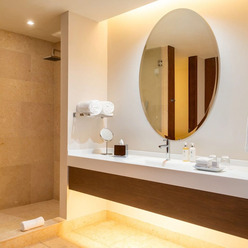 Refresh in a spa-like bath with oversized mirror glow.